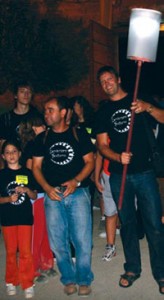 Olive Press editor Jon Clarke carries the beacon to lead Priego de Cordoba's annual nocturnal walk